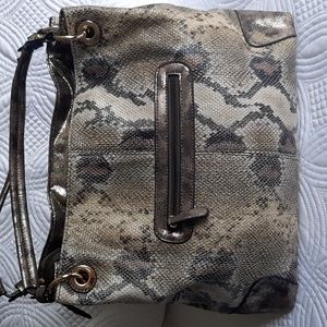 Crystale faux croc print purse  with straps.  Zippered pockets